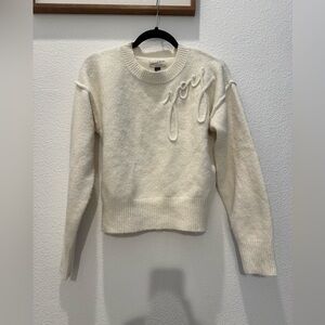 Universal Thread cream-colored crewneck sweater w “Joy” embroidered cursive text